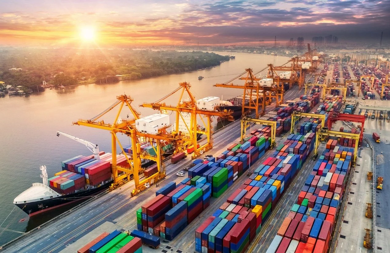 Container port and river at sunrise
